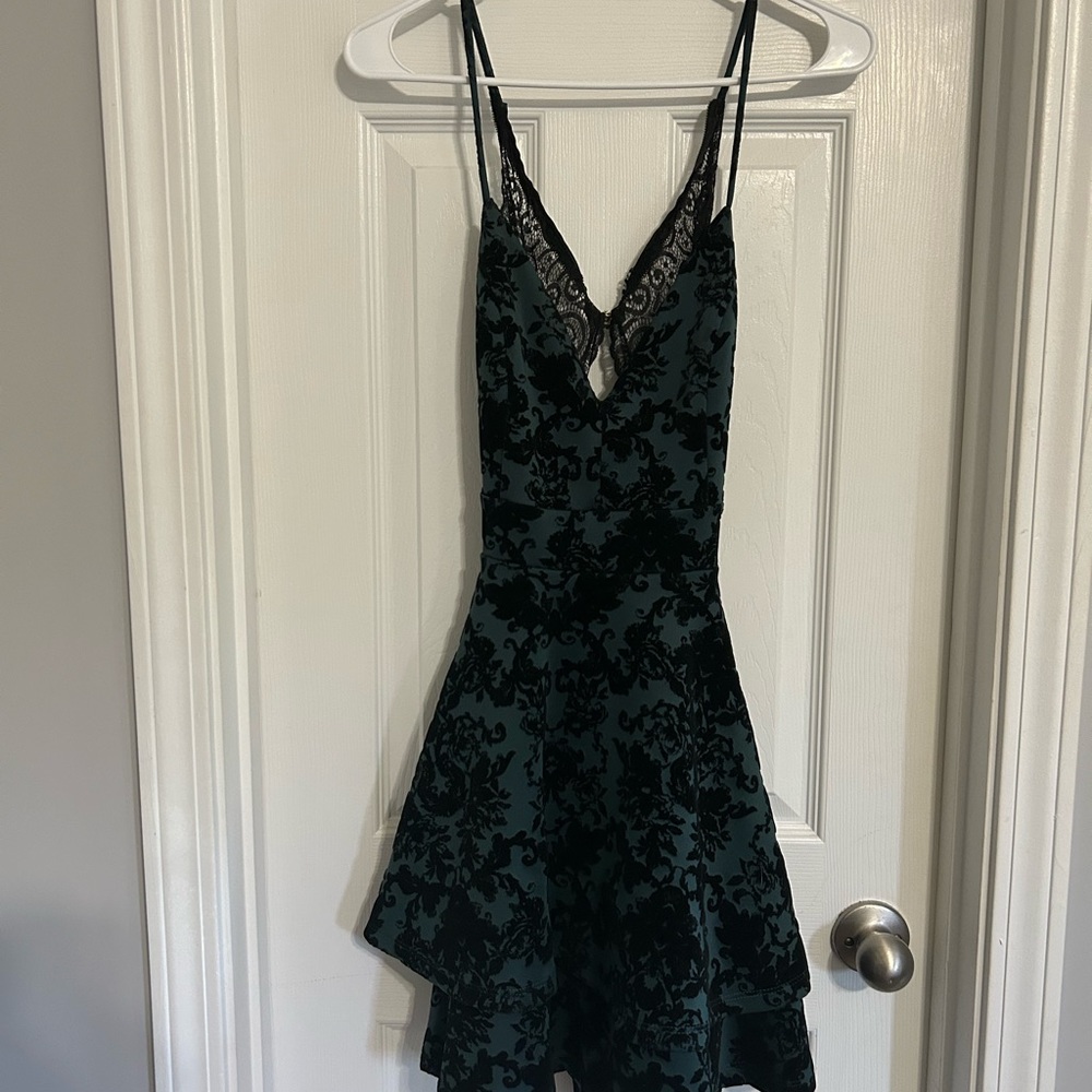 Emerald green and black homecoming dress